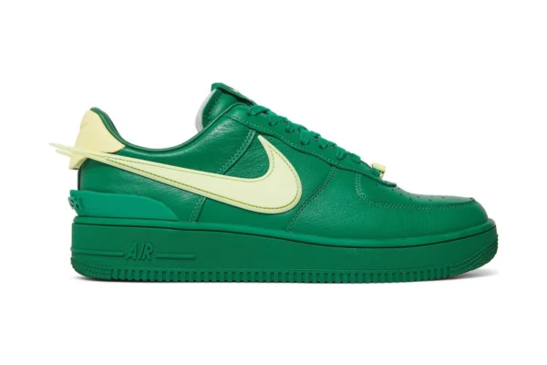 The AMBUSH x Air Force 1 Low 'Pine Green' rep shoes showcase a bold pine green colorway, complemented by unique design elements from AMBUSH.
